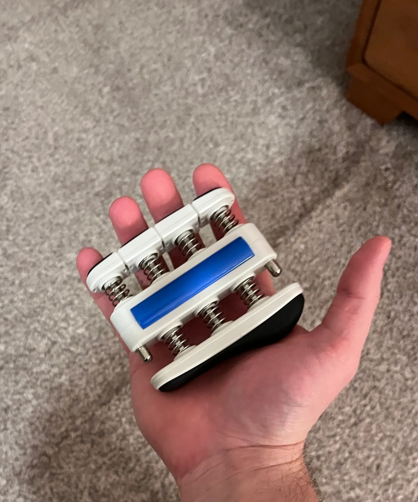 Prohands Gripmaster Lightweight Open Position In Palm Of Hand